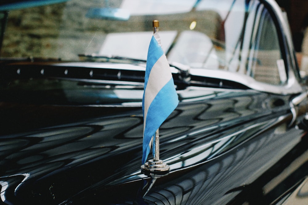 blue and white sailboat scale model