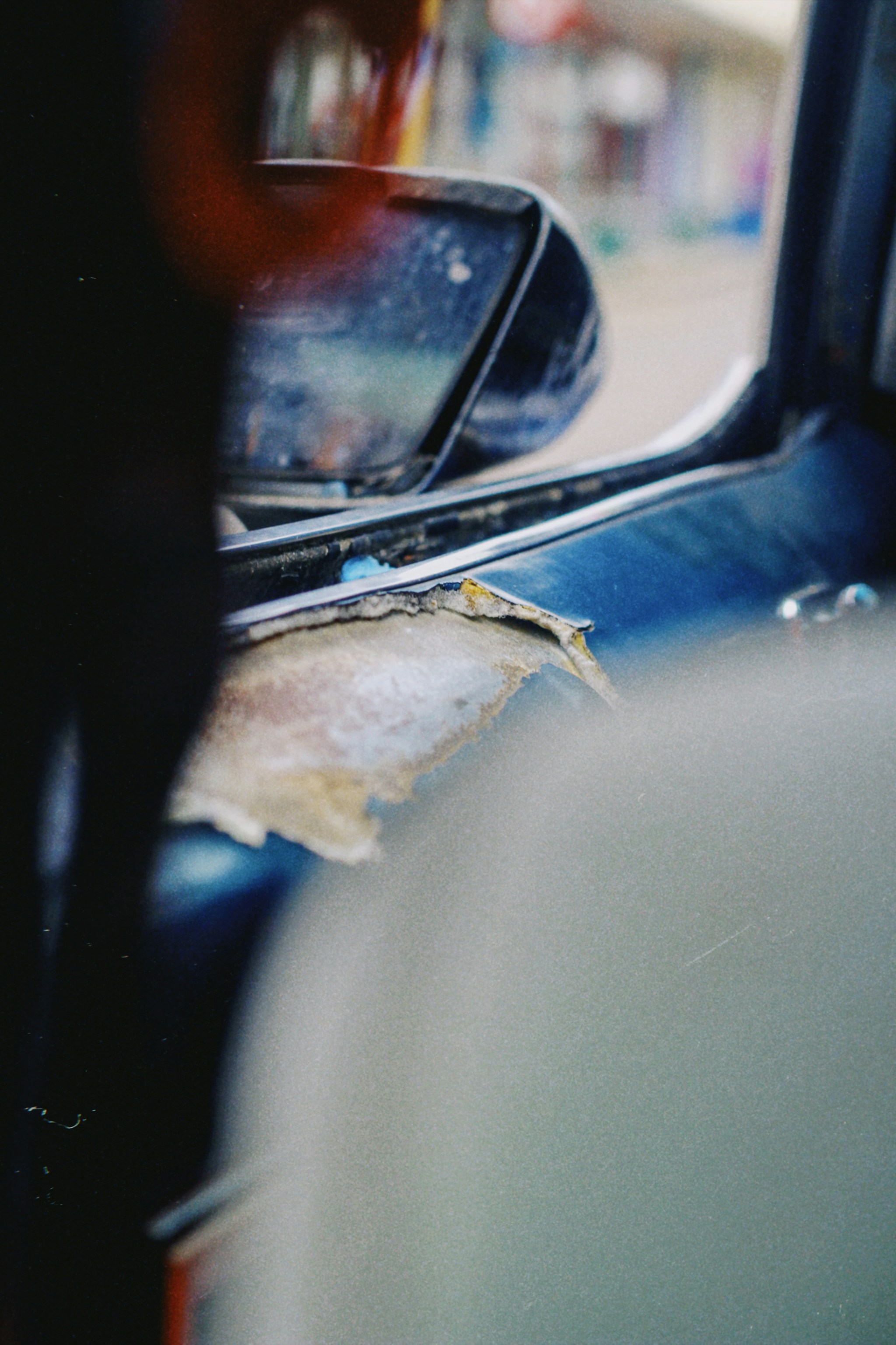 car side mirror with water droplets