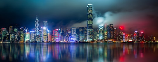 city skyline across body of water during night time in Hong Kong Island Hong Kong