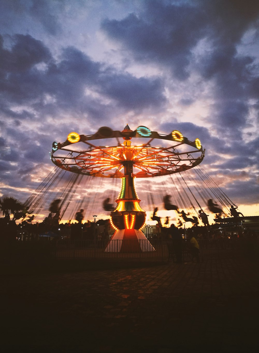 people walking on amusement park during night time