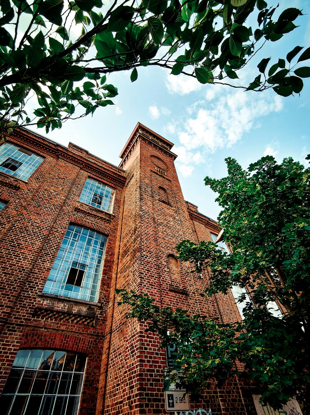 brown brick building under blue sky during daytime