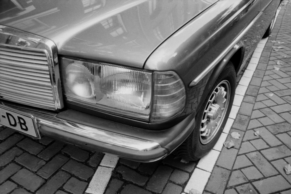 grayscale photo of car headlight