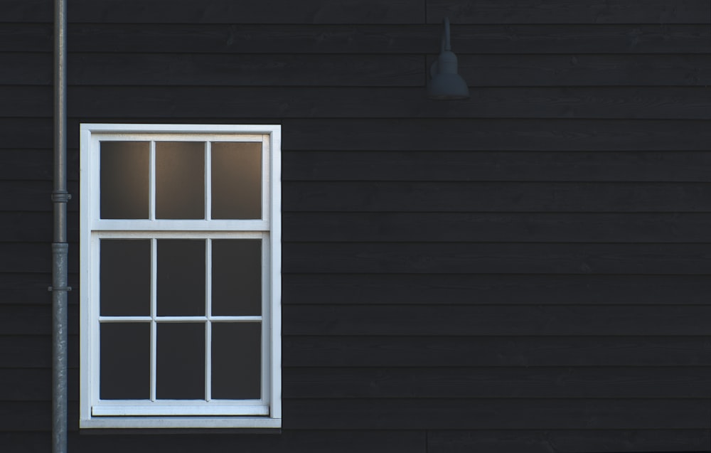 white wooden framed glass window