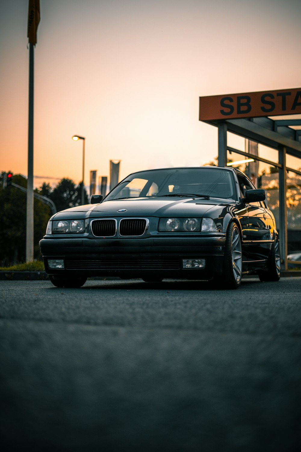 black bmw m 3 parked on parking lot during daytime