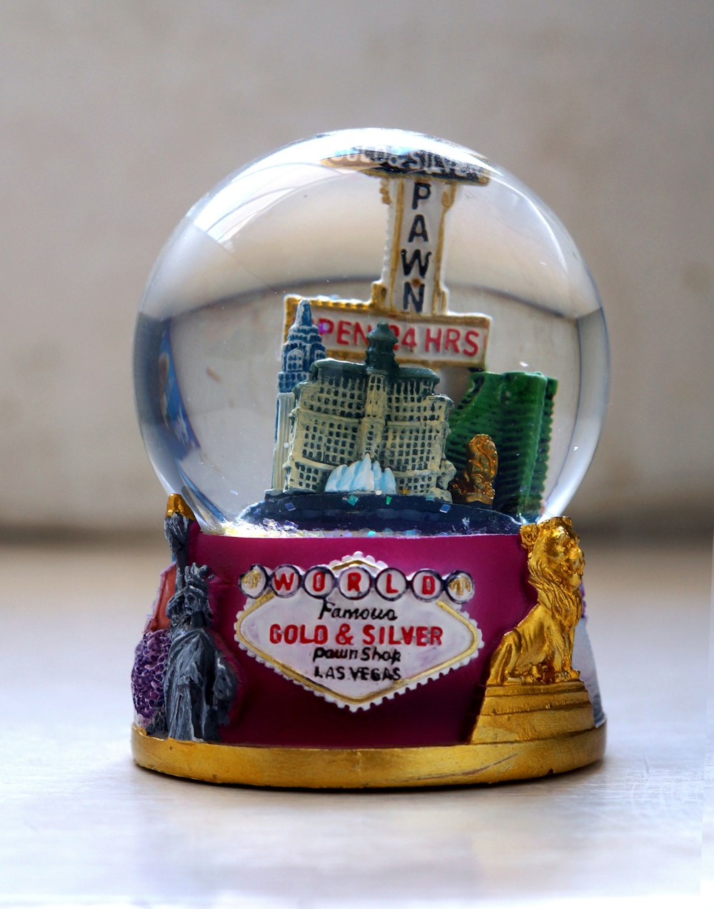 gold and red snow globe