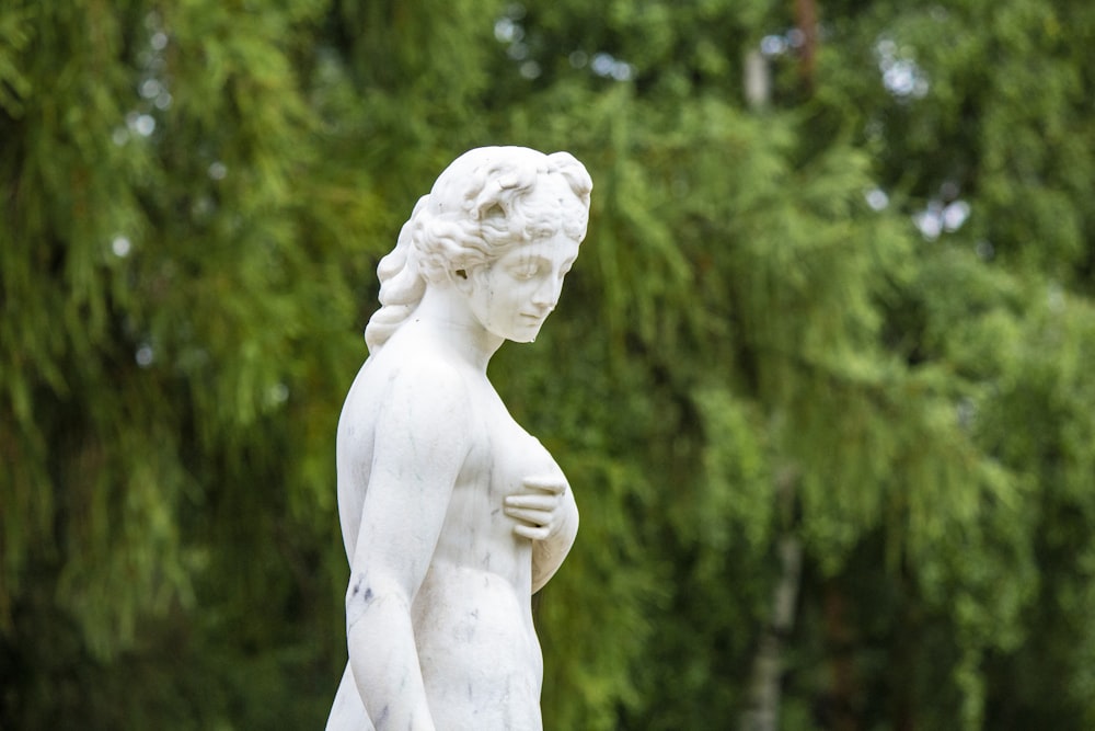 white angel statue during daytime