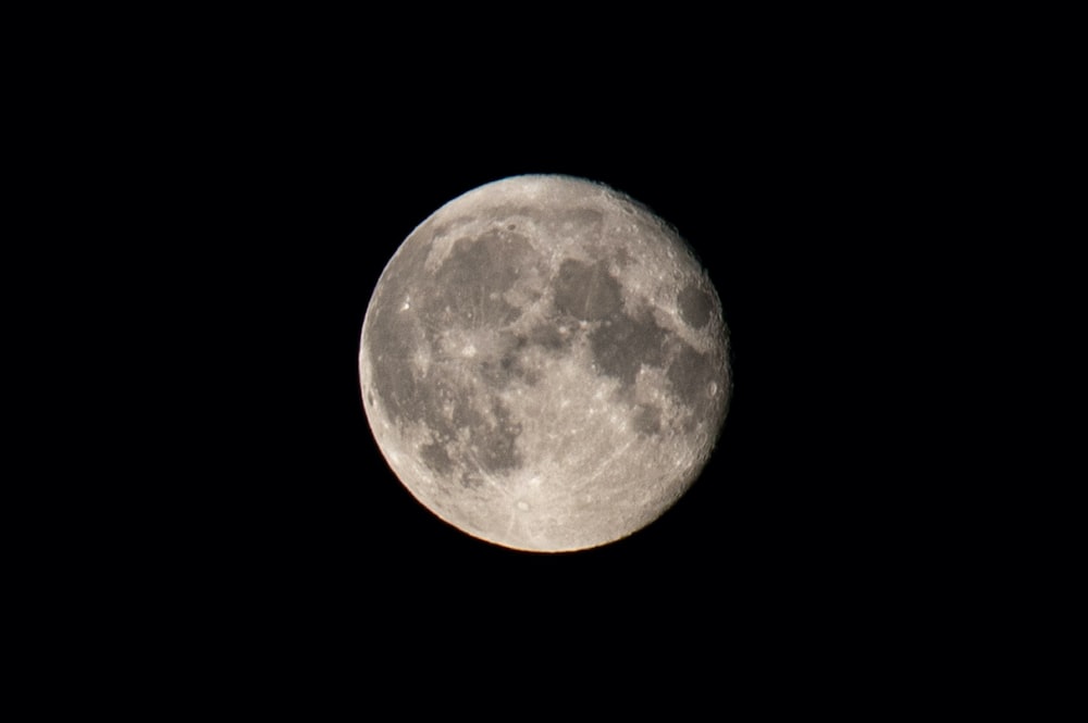 full moon in dark night sky