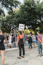 A warm gathering of the French church community during a joyful outdoor service.