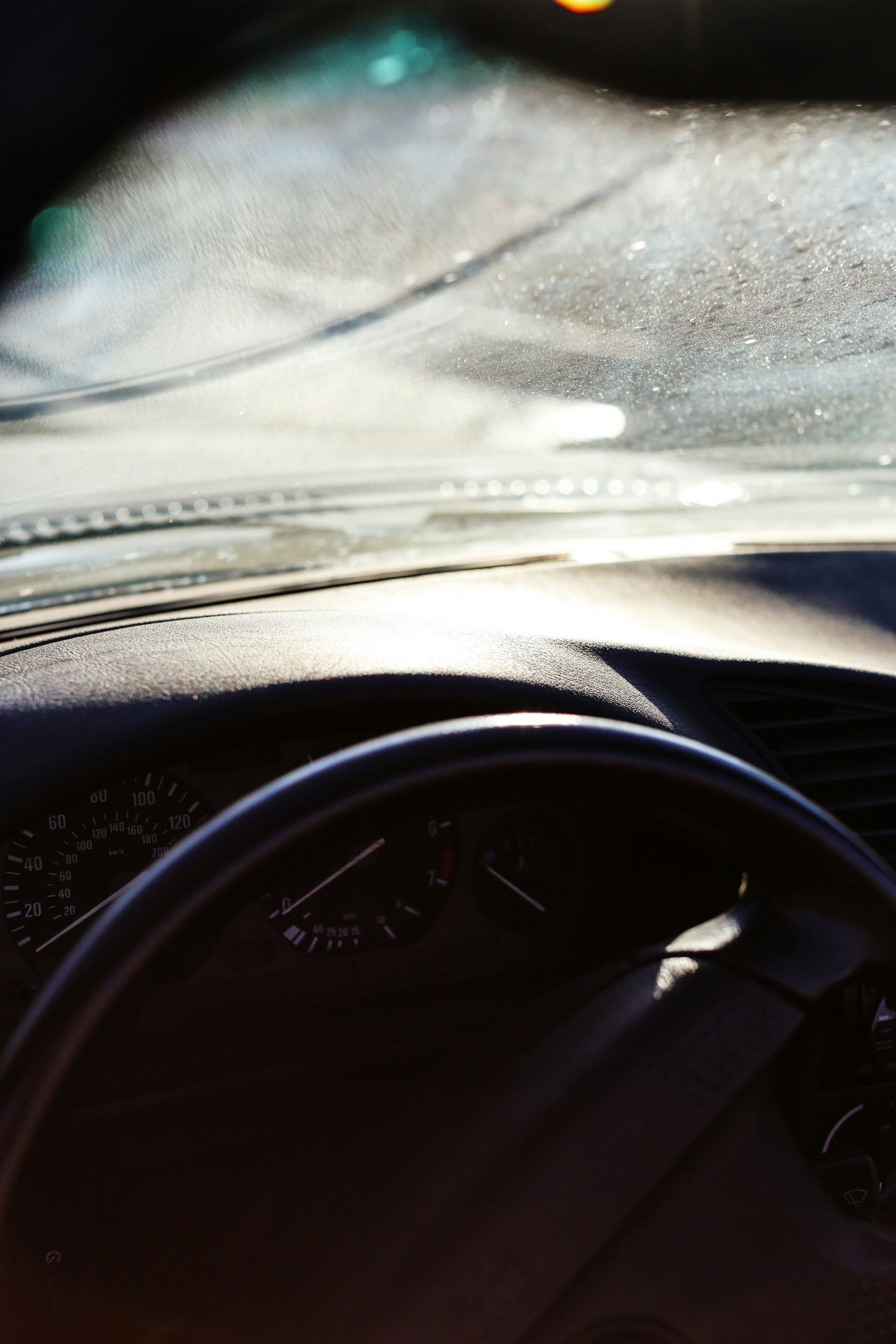 black car steering wheel and dashboard