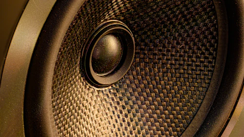 The gold cone of a loudspeaker in close-up