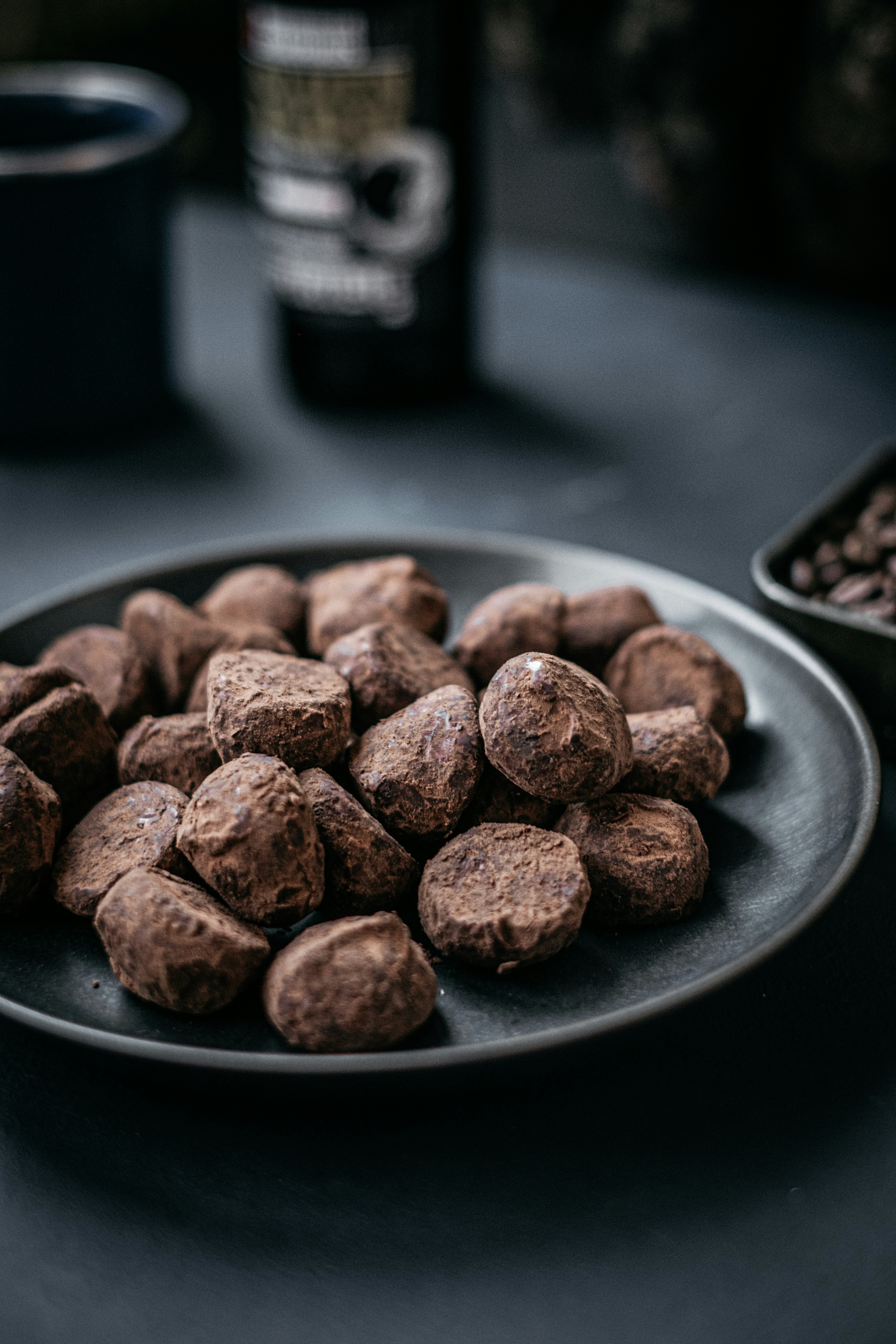 brown round food on black plate