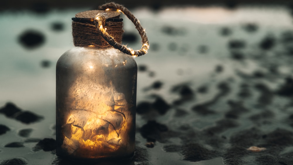 clear glass jar with brown rope