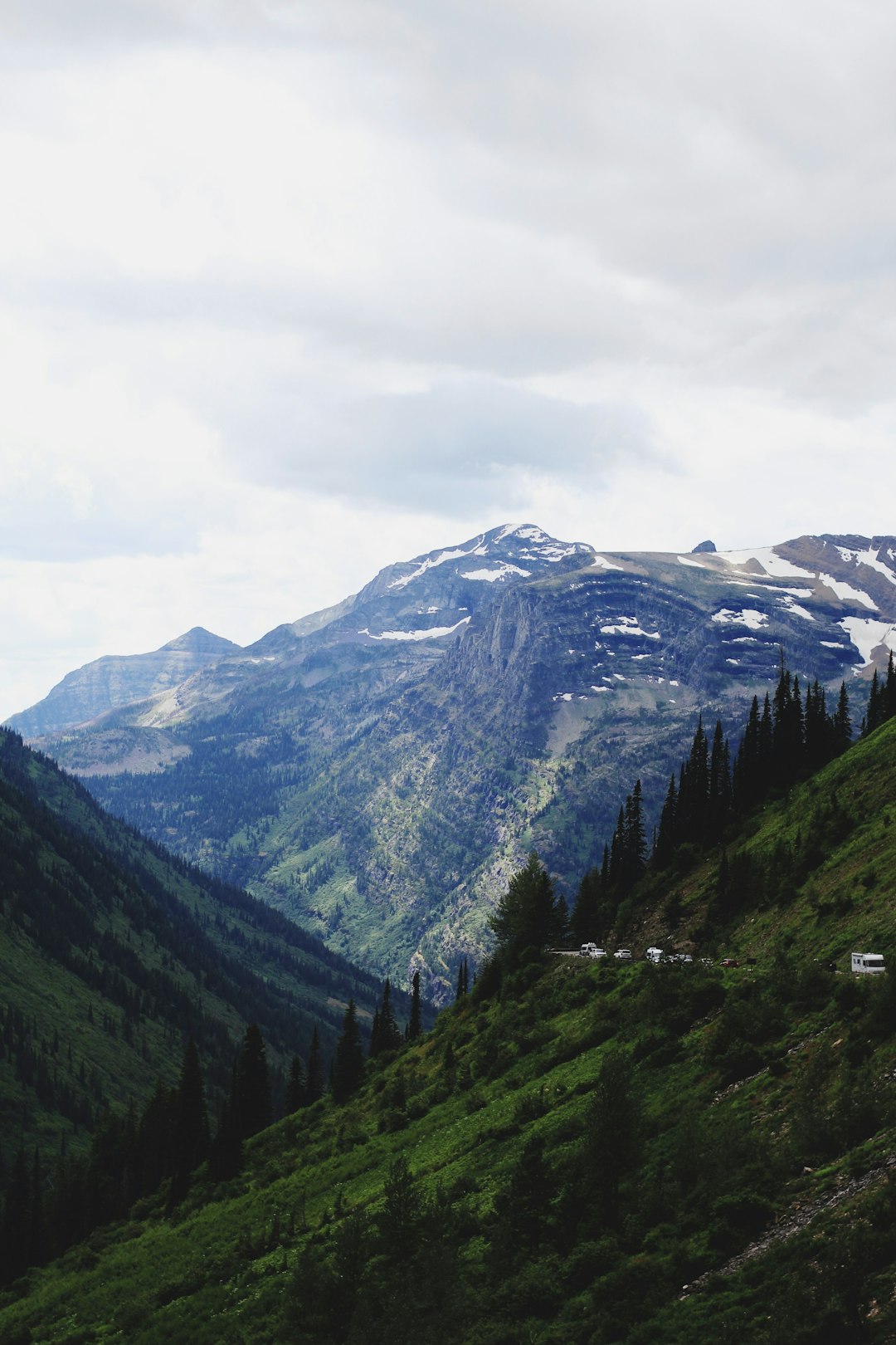 green and brown mountains under white cloudy sky during daytime