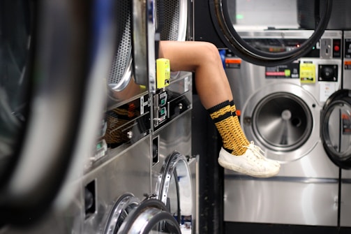 person holding yellow plastic tube