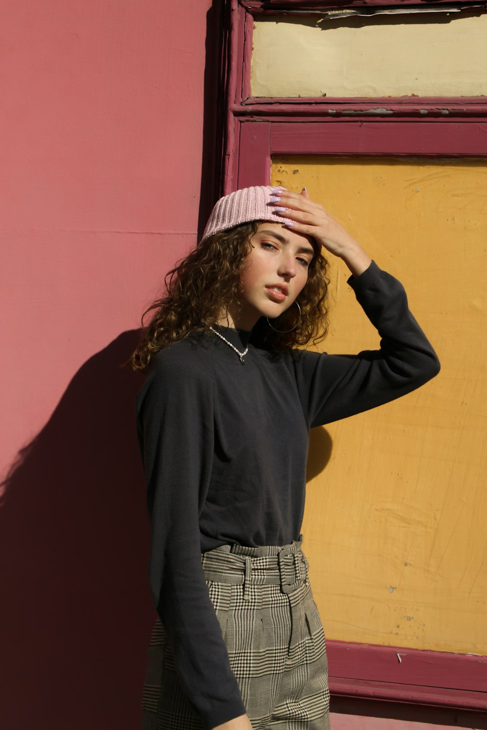 woman in black long sleeve shirt and white and black skirt