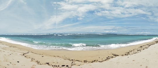 sea waves crashing on shore during daytime in Malang Indonesia