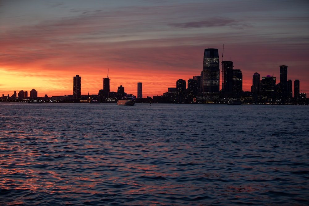 silhouette of city buildings during sunset