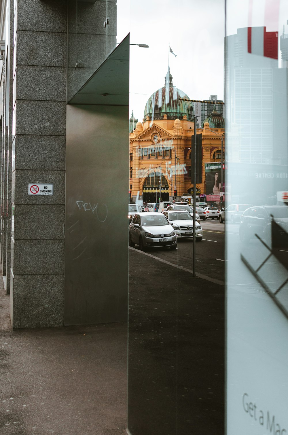 cars parked beside building during daytime