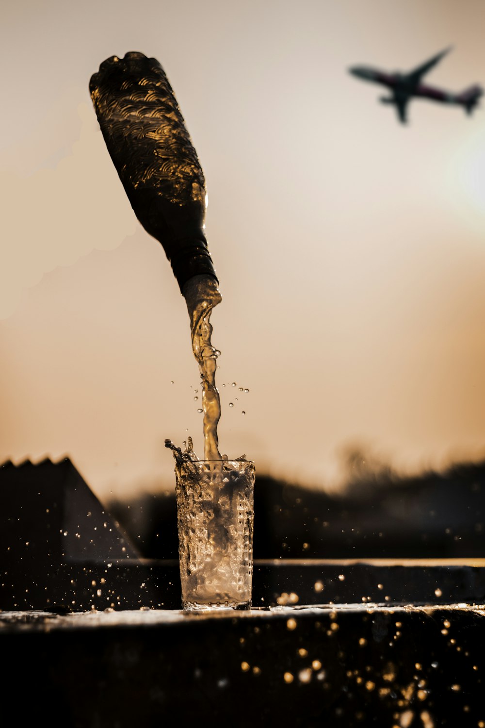 person in black pants and black boots holding water fountain