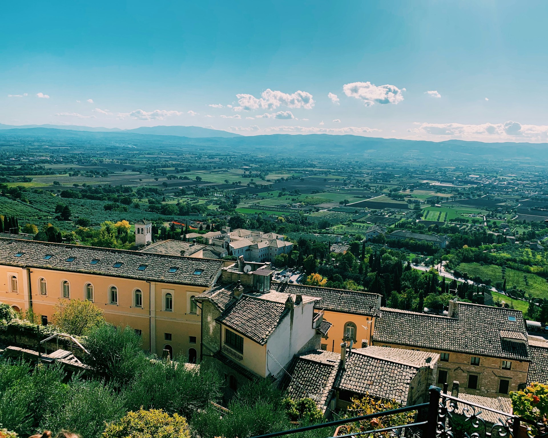 woman wearing yellow long-sleeved dress under white clouds and blue sky during daytime