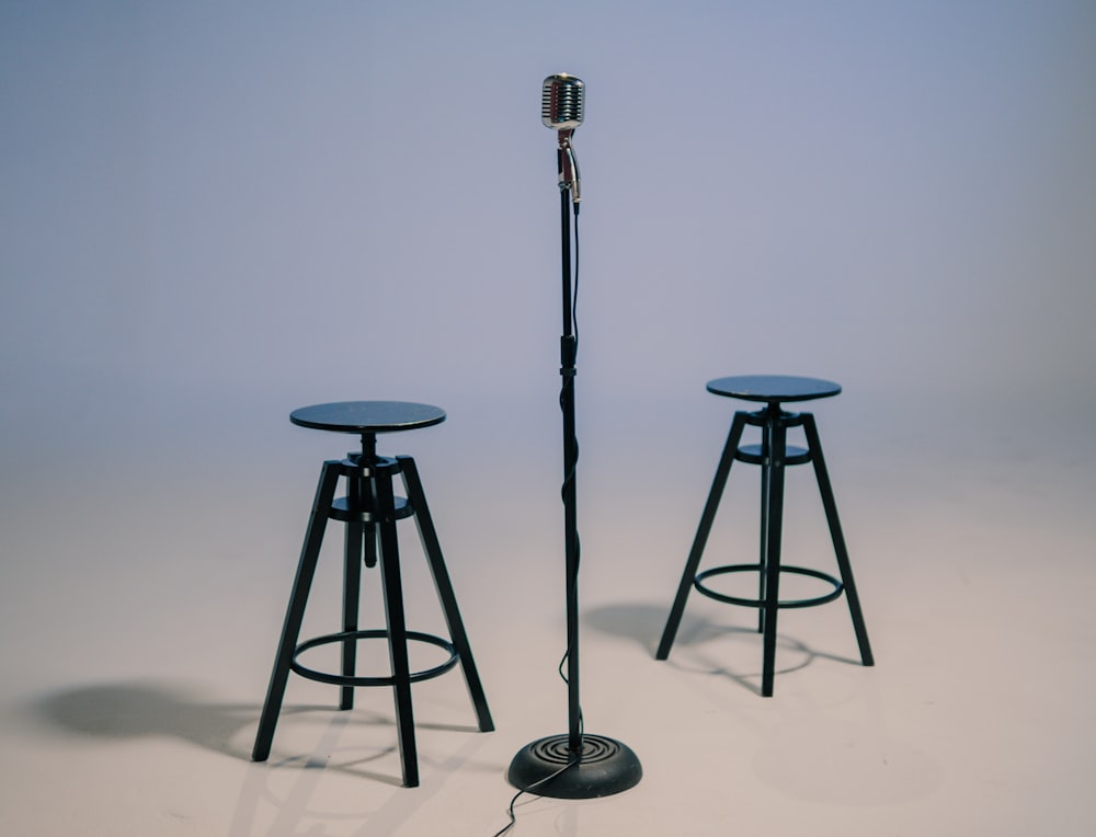 black and gray tripod stand