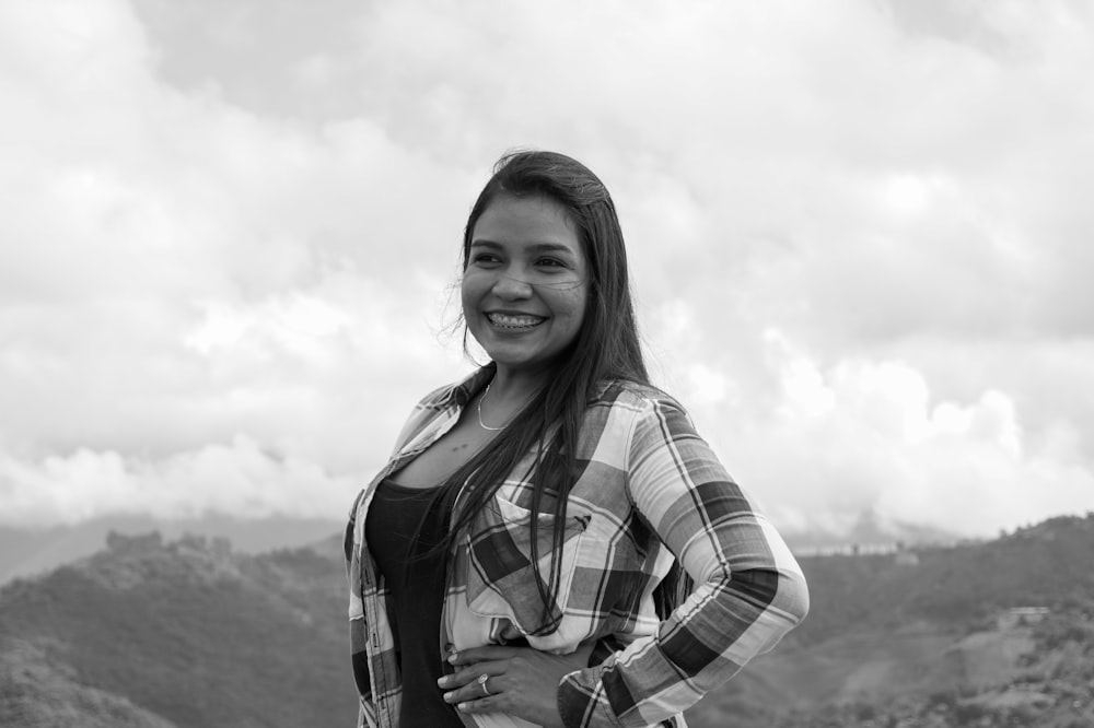 grayscale photo of woman in plaid shirt