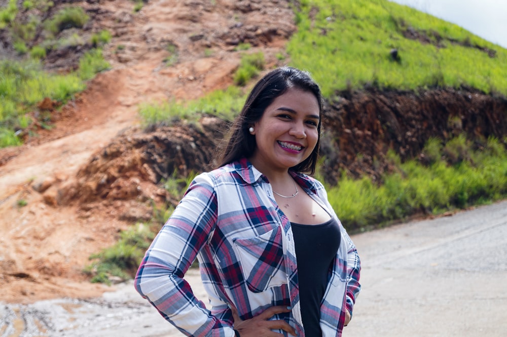 woman in white red and black plaid dress shirt smiling