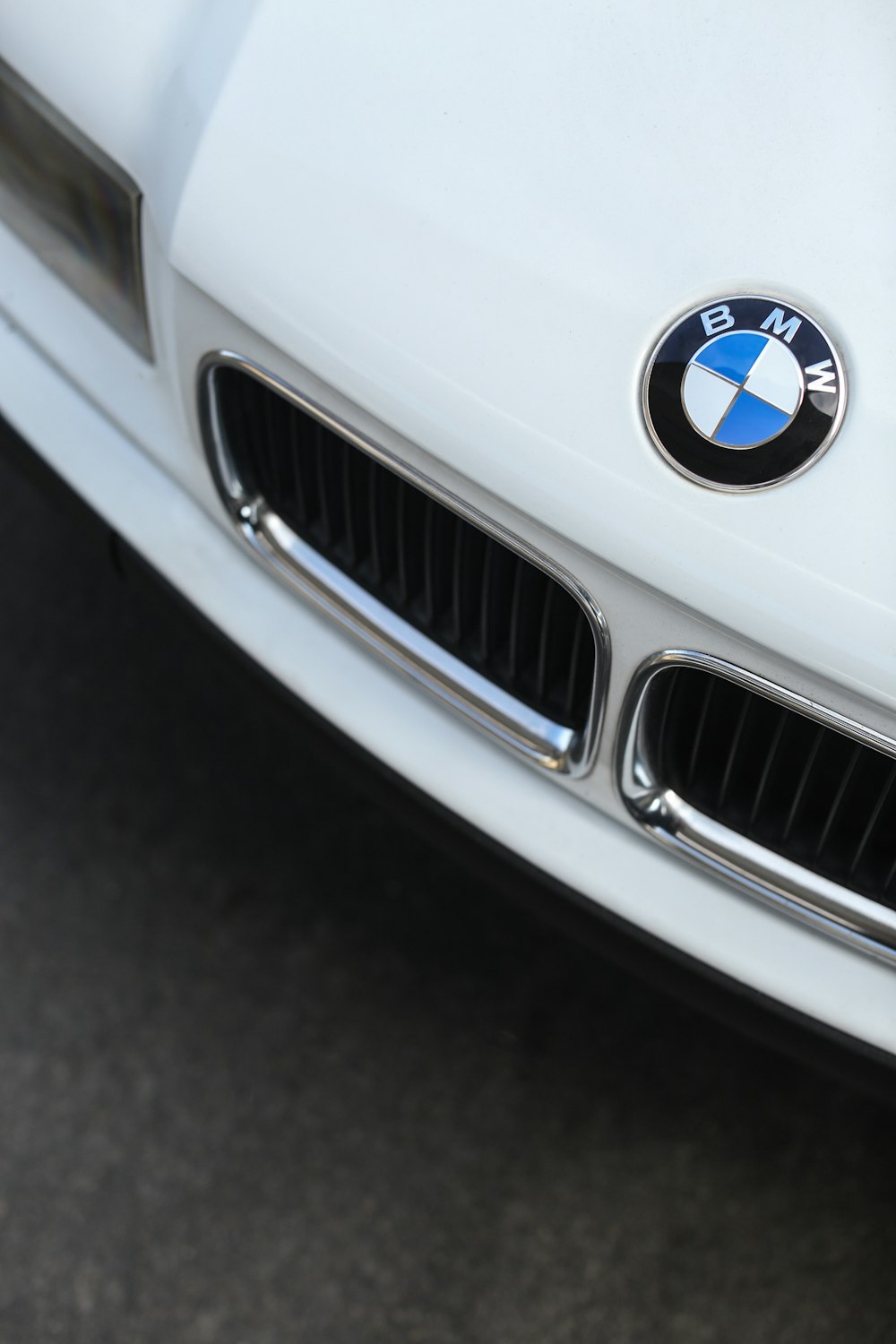 white bmw car with blue and white logo