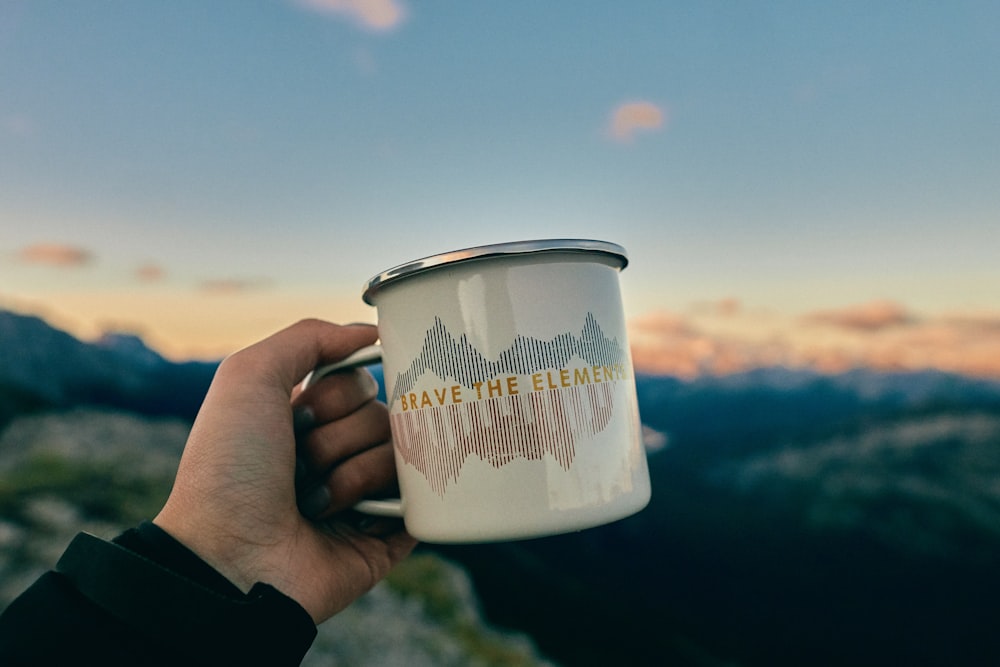 white and blue ceramic mug