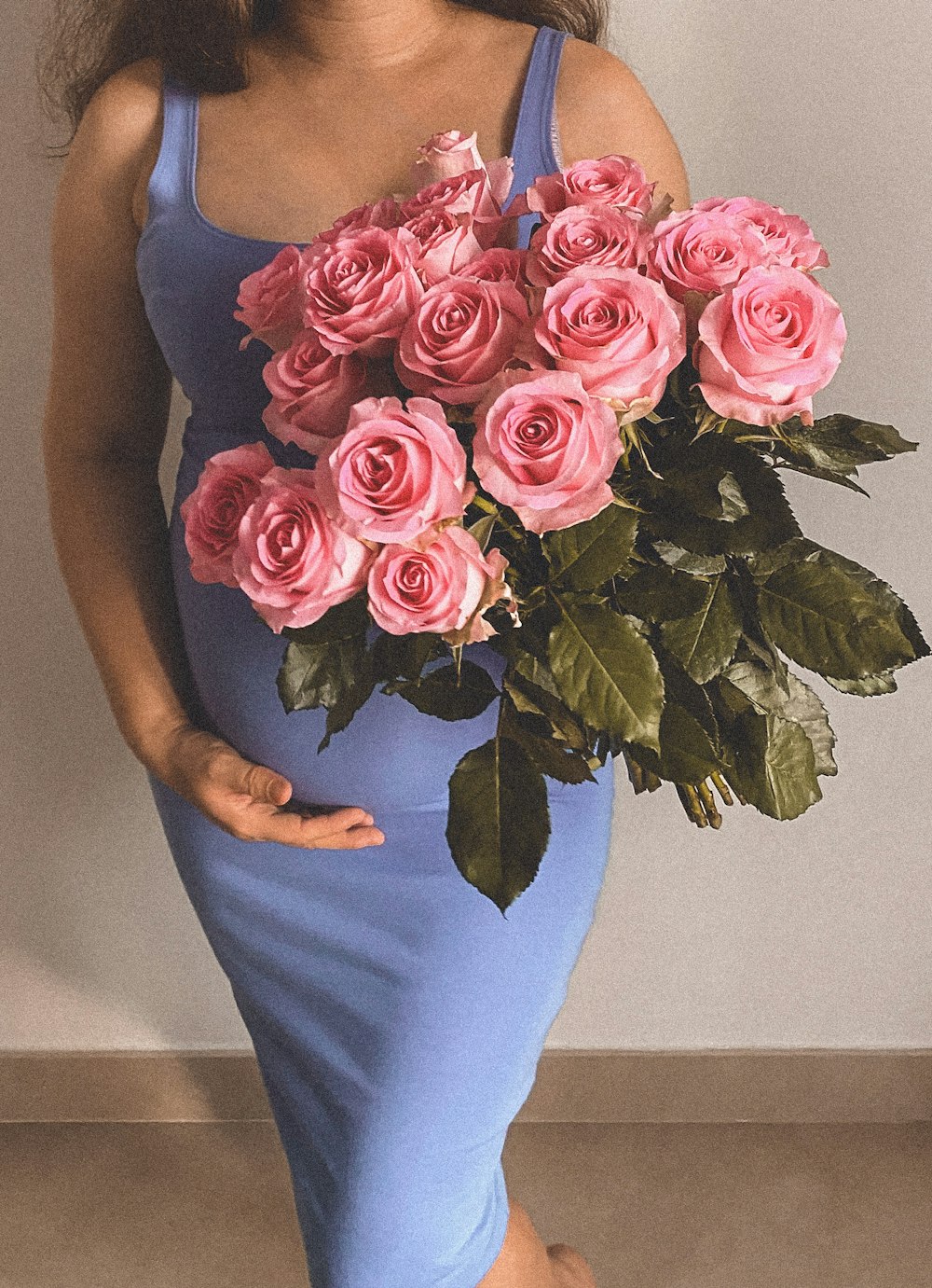 woman in pink rose bouquet