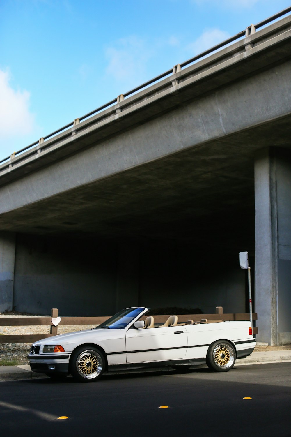 a white car parked on the side of the road