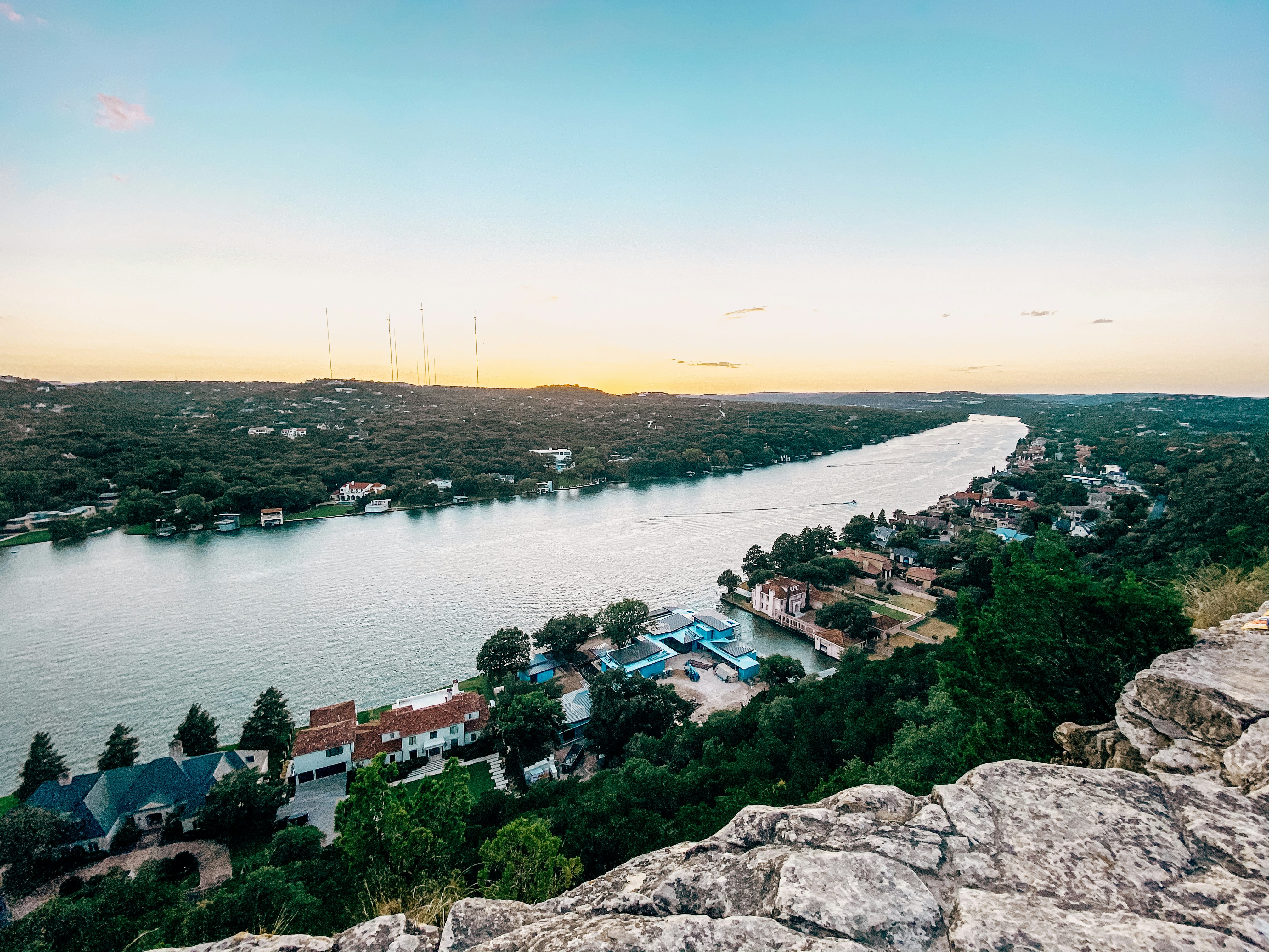 aerial view of houses near body of water during daytime