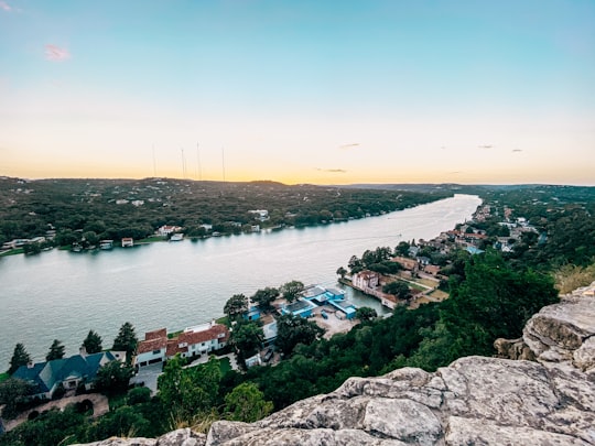 aerial view of houses near body of water during daytime in Austin United States