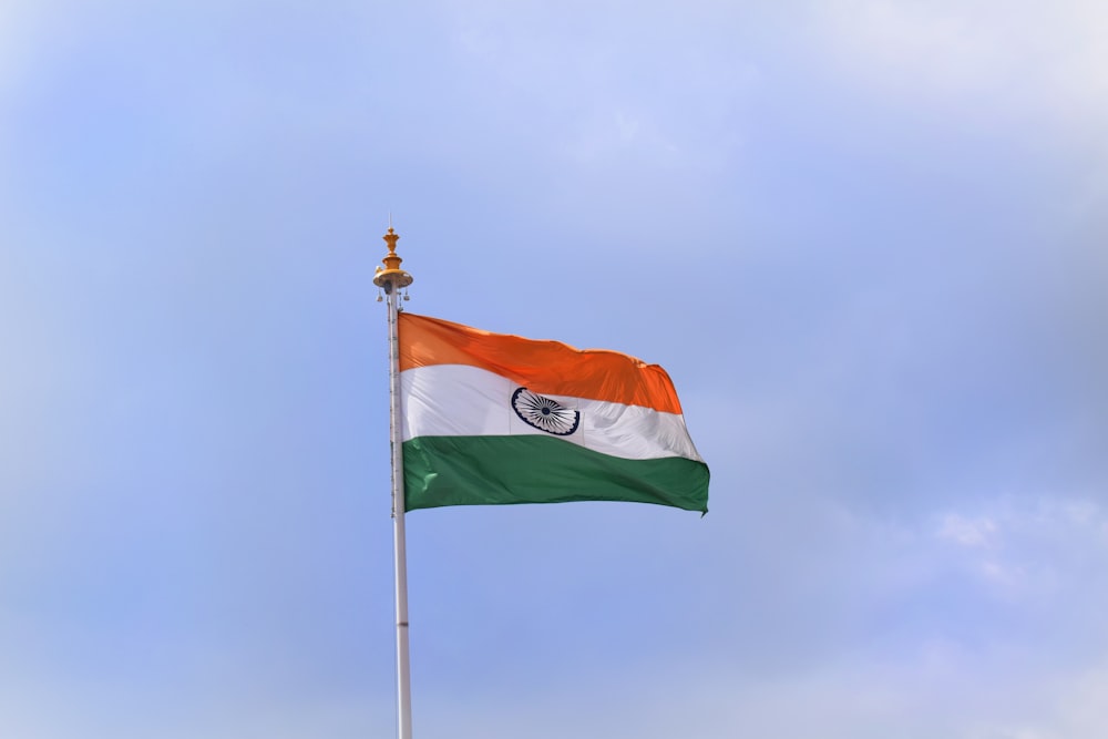 red white and green flag under blue sky during daytime