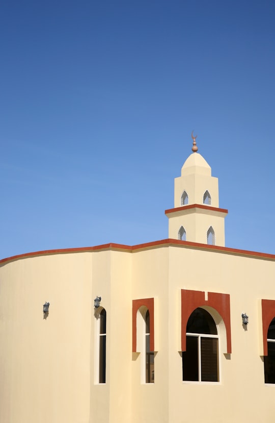 beige concrete building under blue sky during daytime in Ras al Khaimah - United Arab Emirates United Arab Emirates