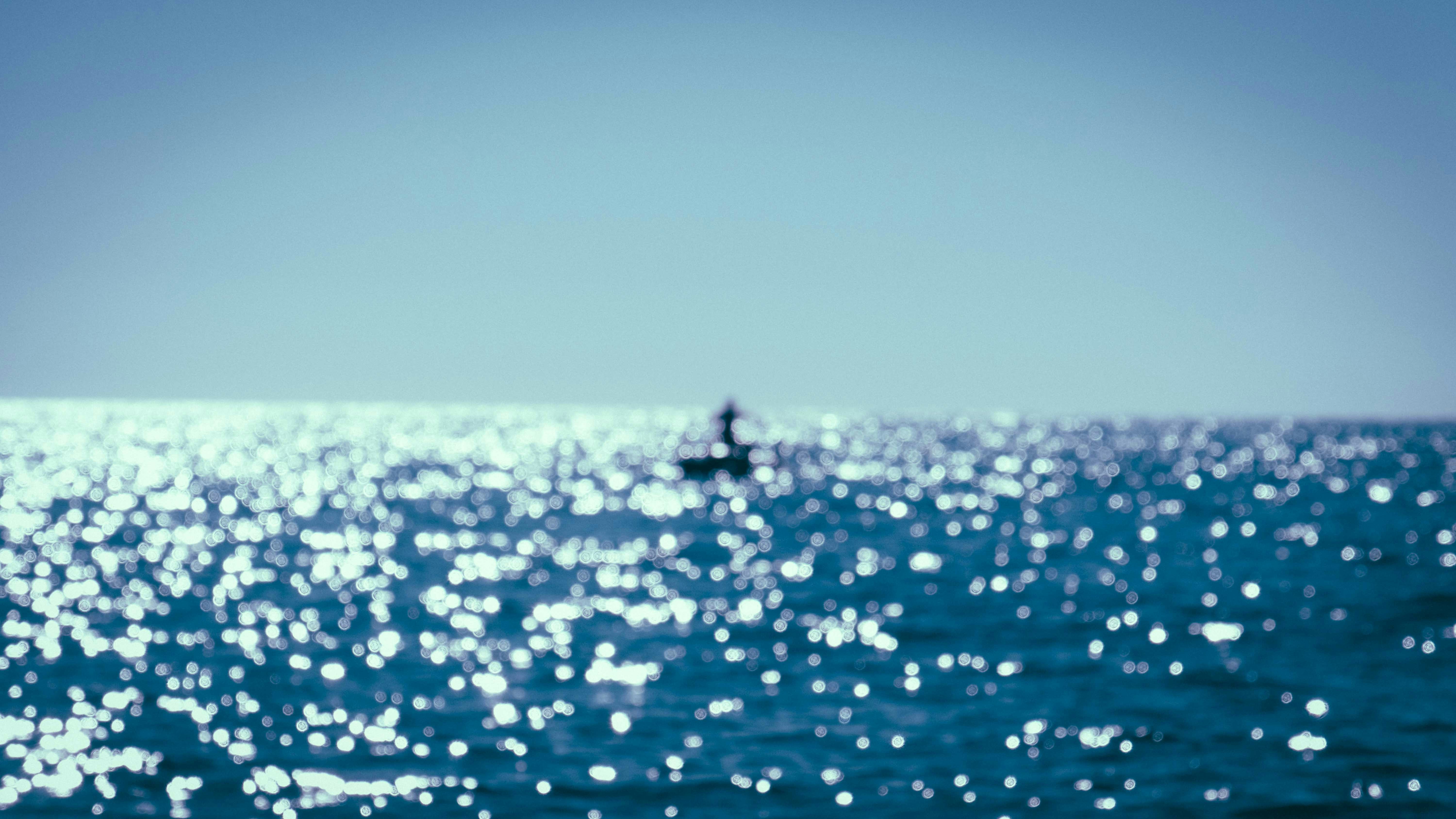 blue sea under blue sky during daytime