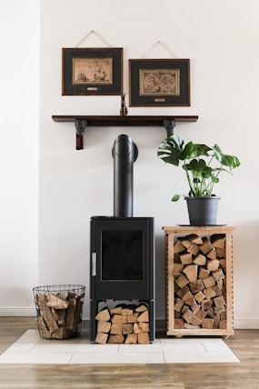 black fireplace beside brown woven basket
