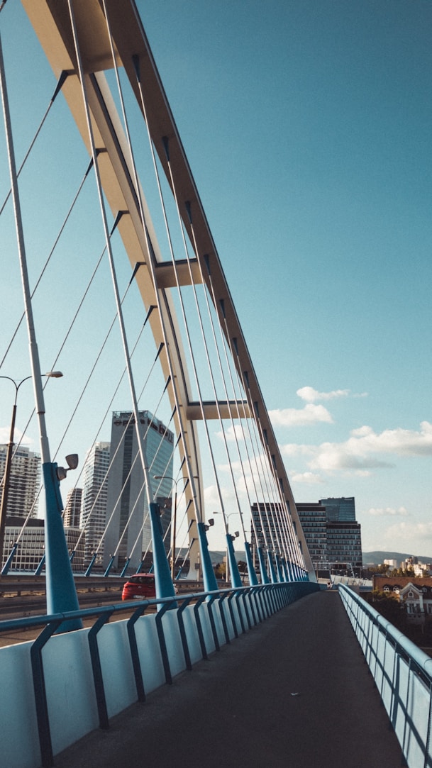 blue and white bridge under blue sky during daytime