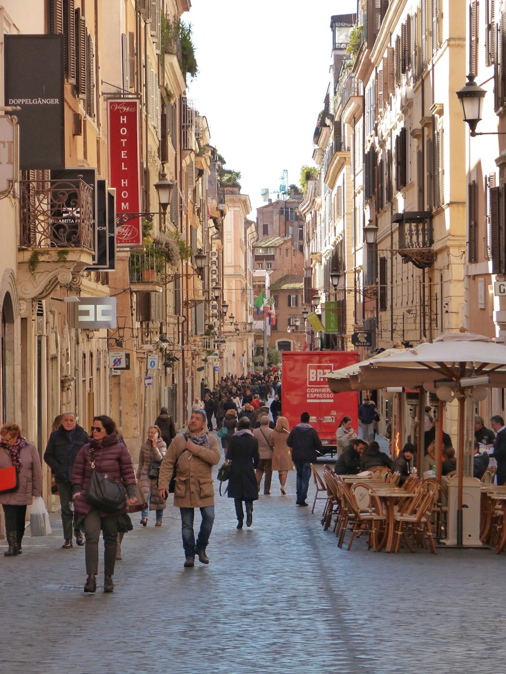 people walking on sidewalk during daytime