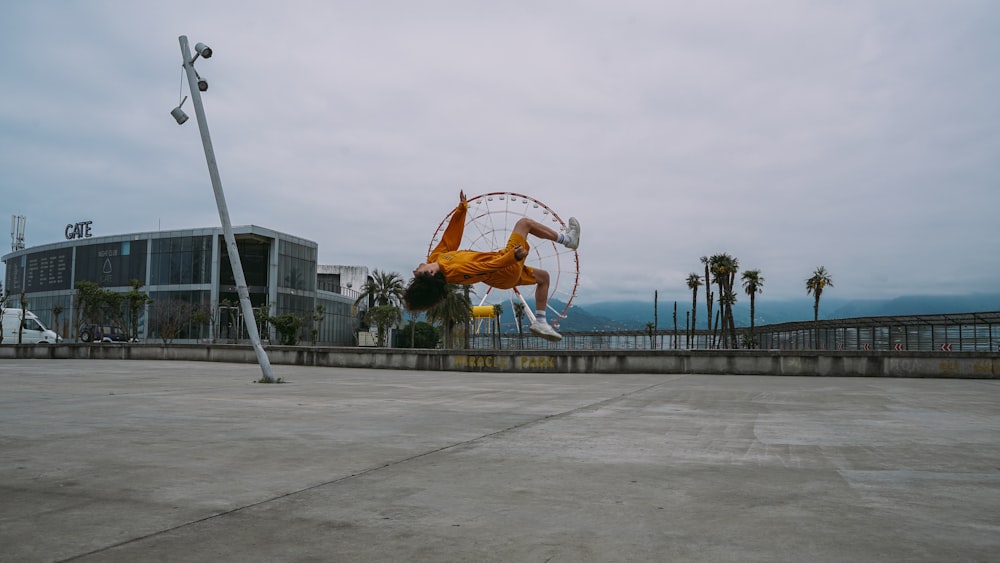 man in orange jersey shirt playing basketball during daytime