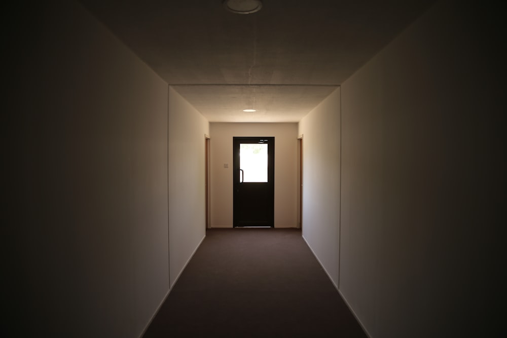 white wall with brown wooden framed glass window