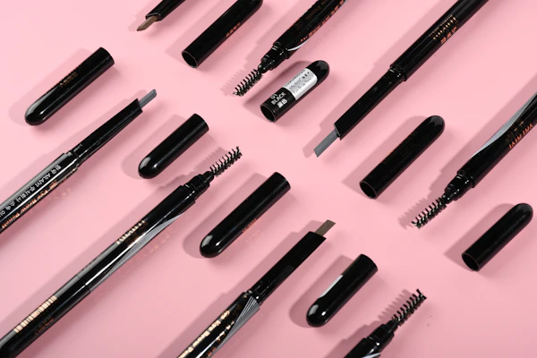 A selection of eyebrow pencils and gels with fine tips, perfect for precise shaping.