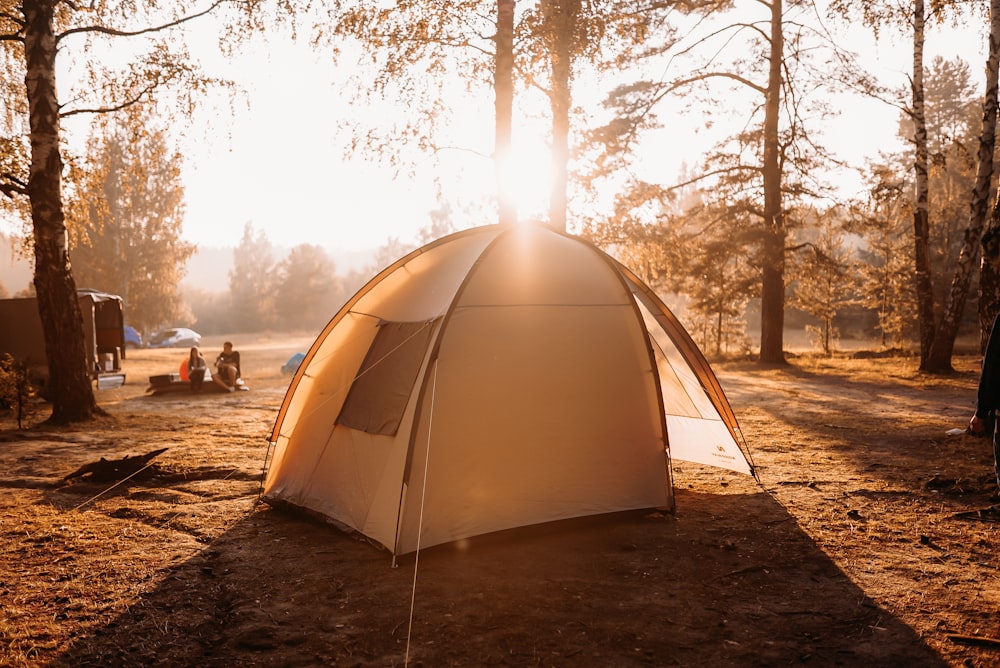 white dome tent on brown field during daytime