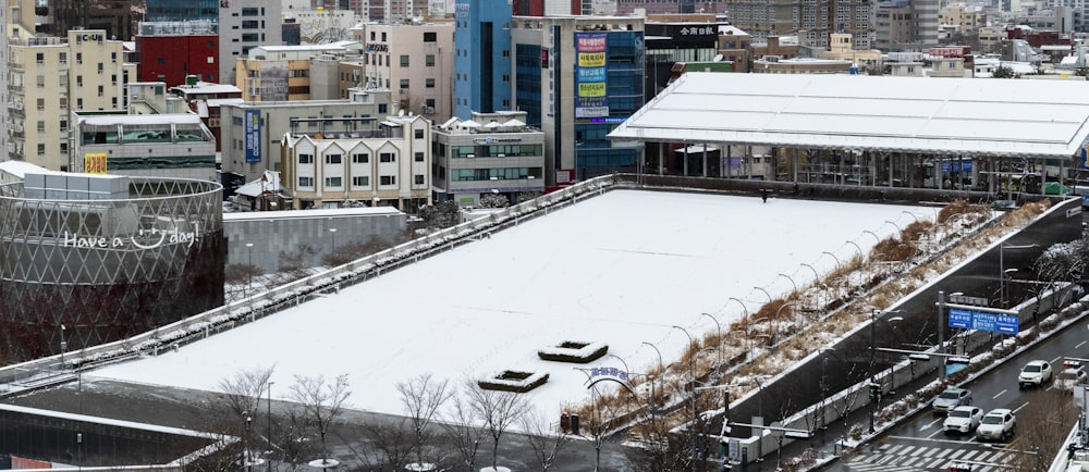 cars parked on parking lot near building during daytime