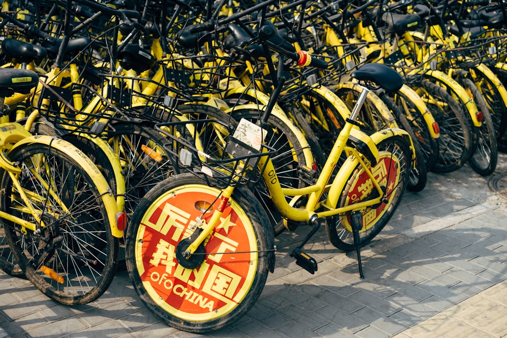 yellow and black bicycle on gray concrete floor