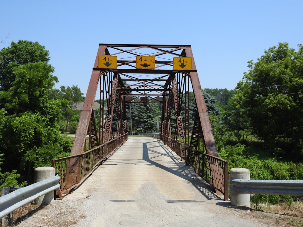 brown wooden bridge under blue sky during daytime