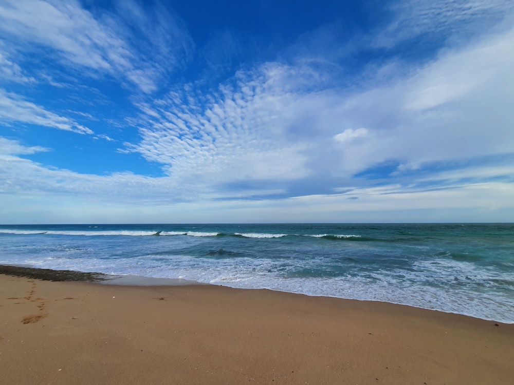 blue sea under blue sky during daytime