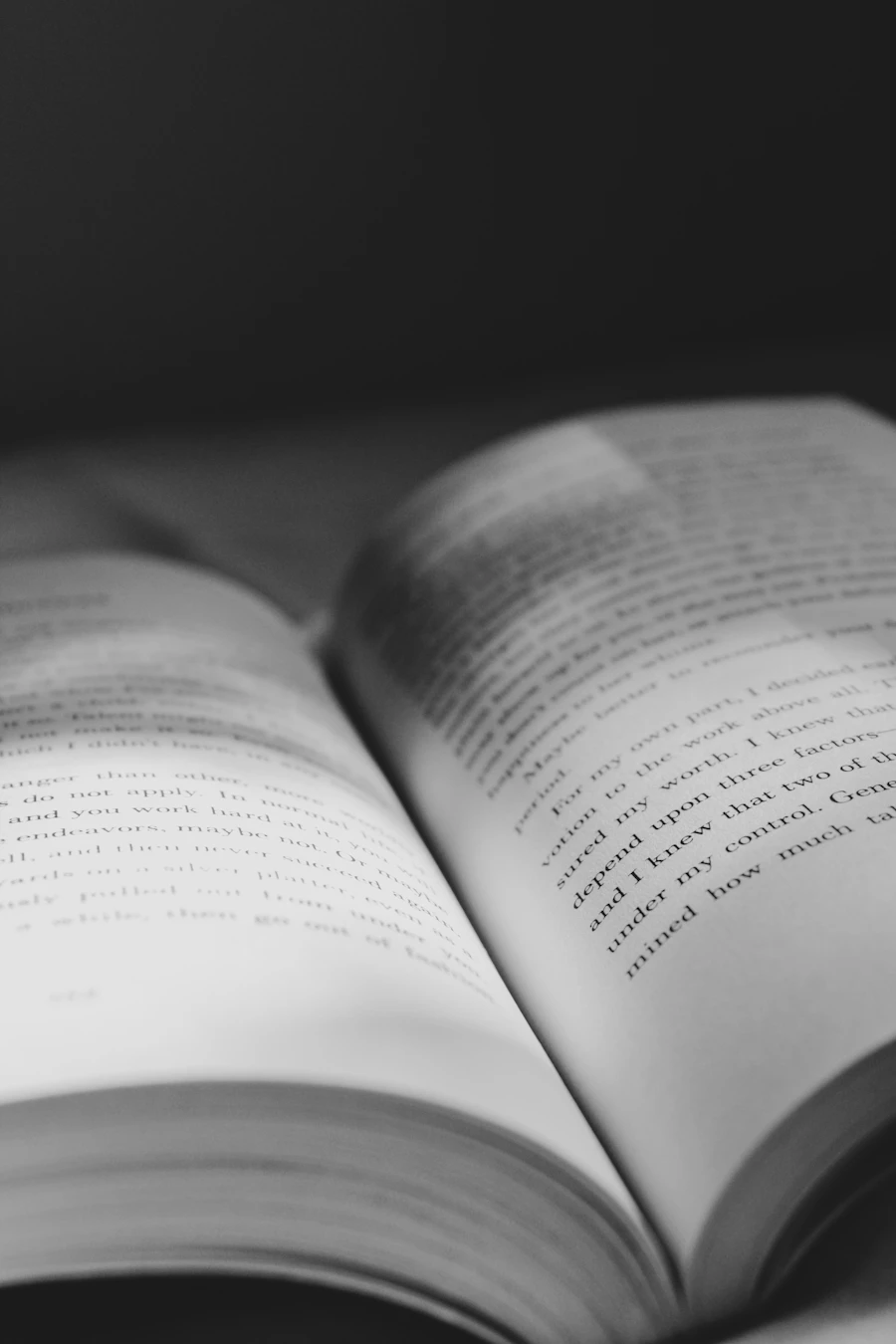 Close-up of book pages in dramatic lighting