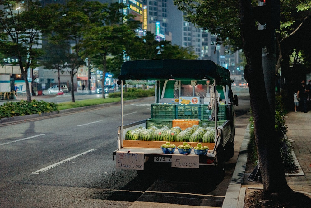 green and white food truck on road during daytime