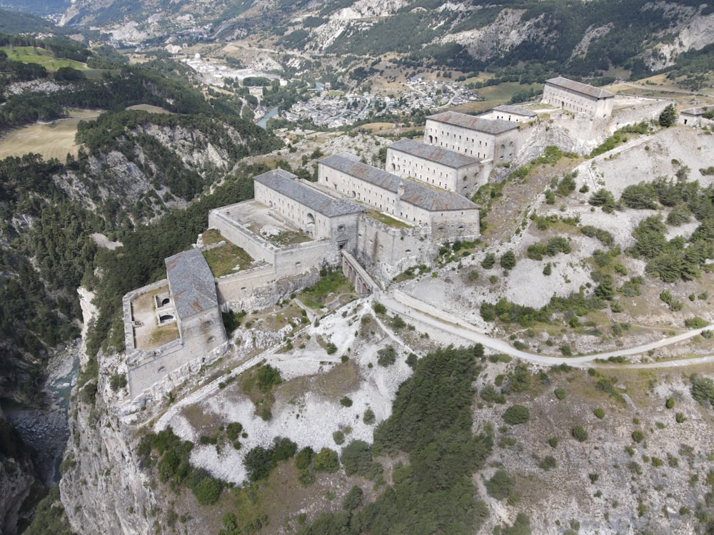 white concrete building on top of mountain during daytime